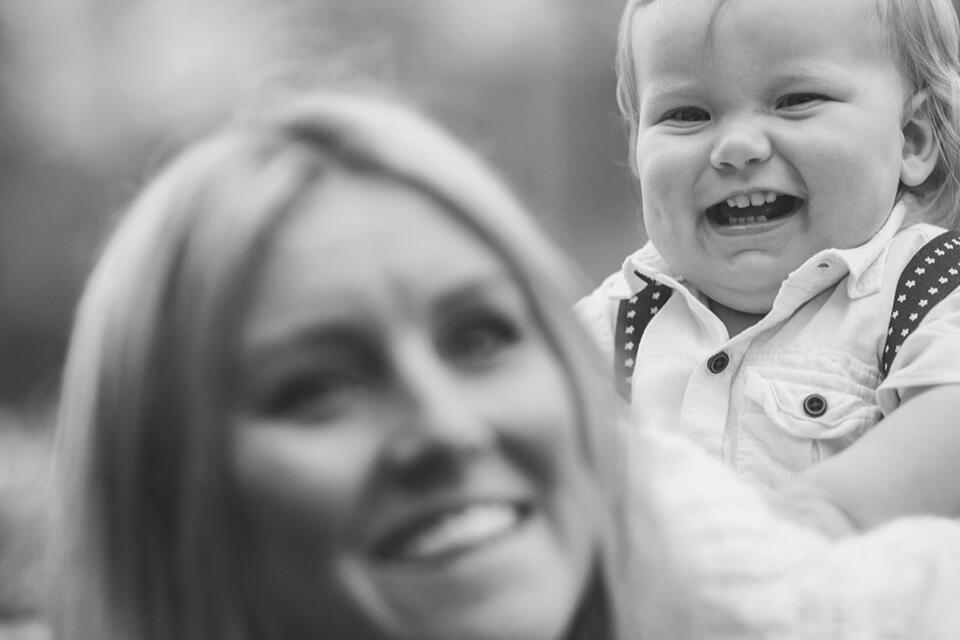 Luxury Christmas Family Photo Sessions at Home – Lincolnshire Beautiful picture of a mum playing with her baby during a at-home Christmas photo session